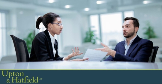 Woman discussing resume at interview