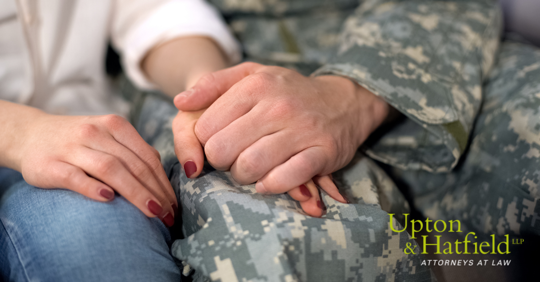 Military husband and wife holding hands