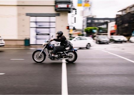 motorcyclist riding through an intersection