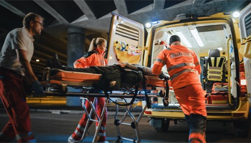parademics loading injury victim into ambulance