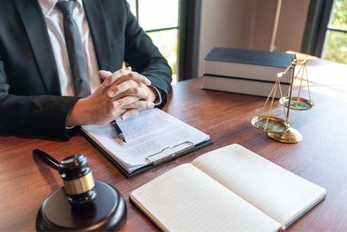 personal injury attorney sitting at desk with paperwork